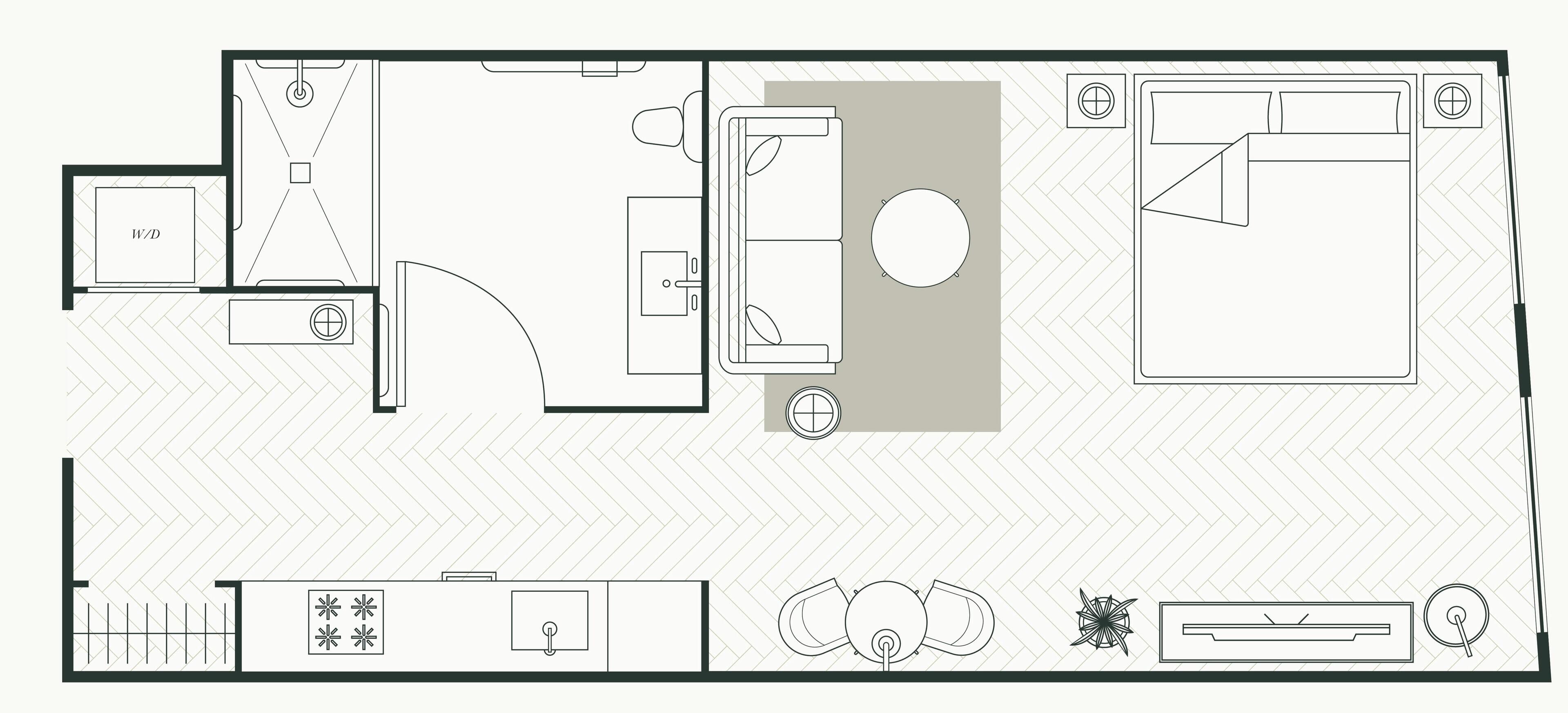 Plan d’étage d’une chambre d’hôtel comprenant une machine à laver et un sèche-linge, un coin cuisine, un espace salon et un grand lit.