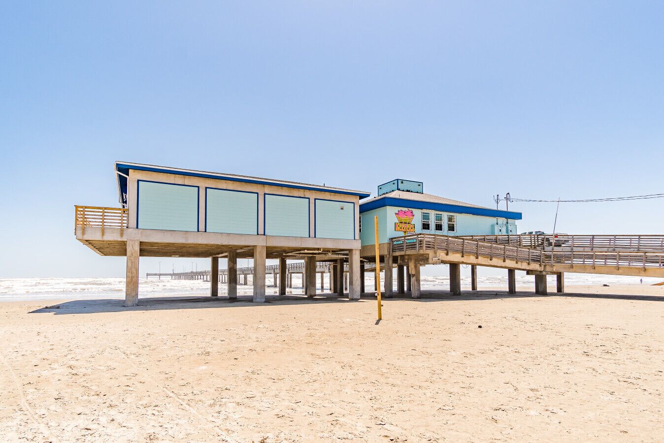 An iconic pier reaching into the sea, surrounded by sweeping beach views—ideal for fishing, sunset walks, and classic seaside moments.