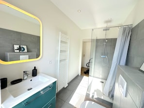 Shower, hair dryer, towels, soap