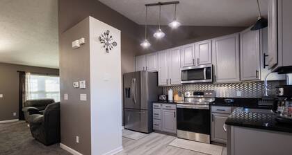 Spacious 4 bedroom house with AC, WiFi in, 2 living rooms, fenced, 2 car garage.