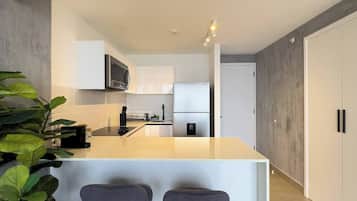 Fridge, microwave, stovetop, coffee/tea maker