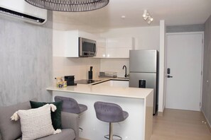Fridge, microwave, stovetop, coffee/tea maker