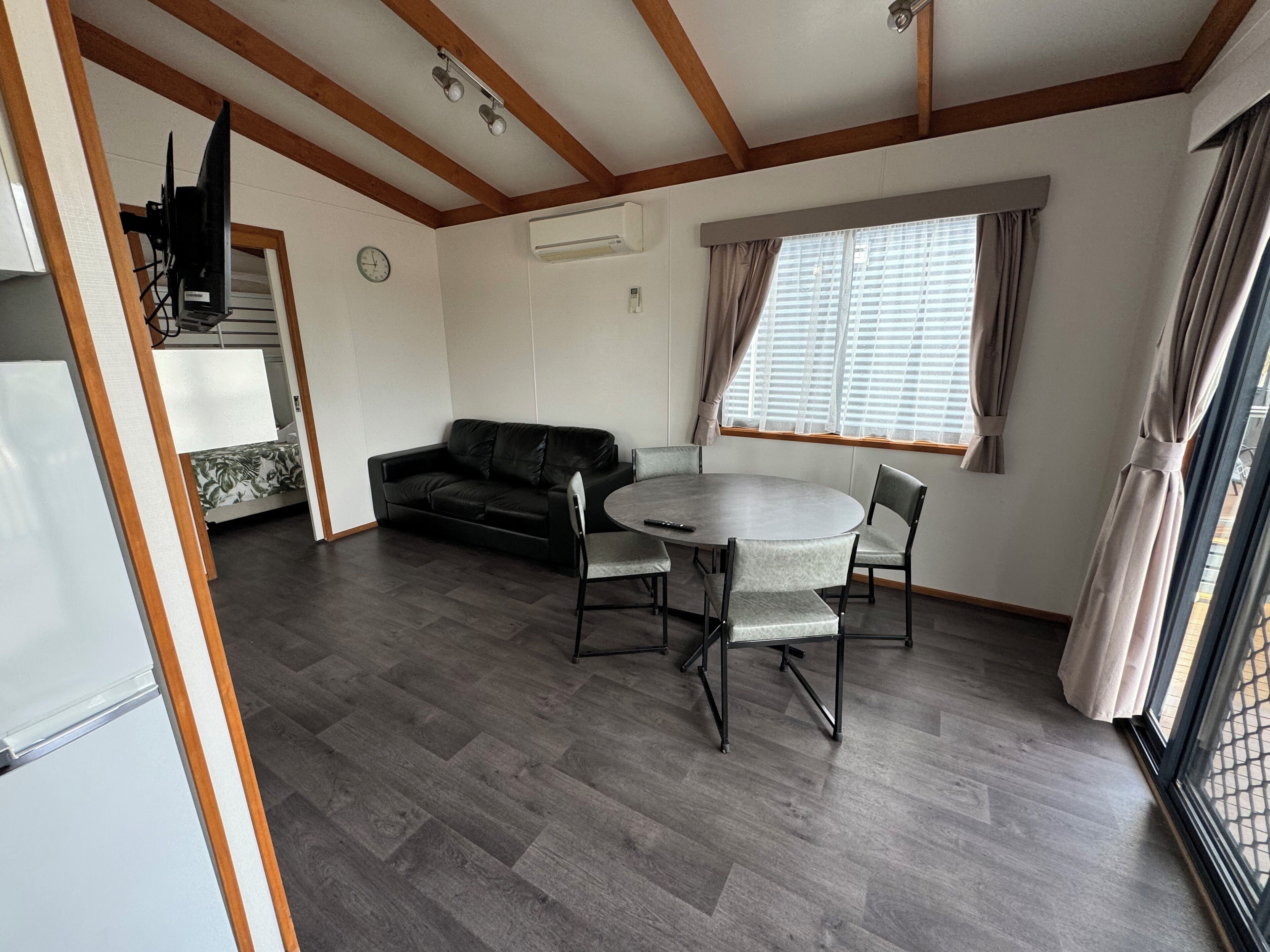 Deluxe Cabin | Living area | Flat-screen TV