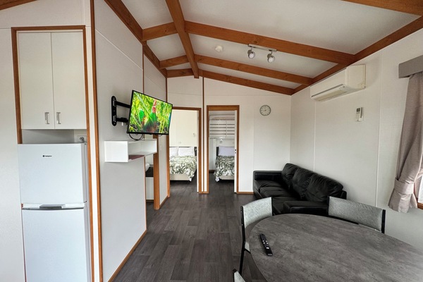 Deluxe Cabin | Living area | Flat-screen TV