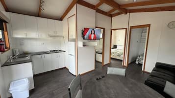 Deluxe Cabin | Living area | Flat-screen TV