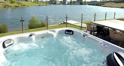 Lakeside retreat with hot tub, games room and on-site spa and pool