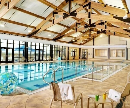 Indoor pool, outdoor pool. "Liberty Living" - A charming home with wooded views for privacy and relaxation.