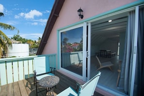 Enjoy a balcony with a table and chairs, offering a serene view of the surrounding landscape.