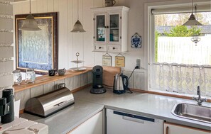 Fridge, stovetop, dishwasher, coffee/tea maker