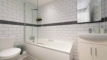 Shower, hair dryer, towels, shampoo
