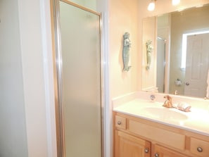 Shower, hair dryer, towels, toilet paper