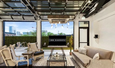 (Unit 2) Inn Cahoots on 6th: 5BR/13BedsPool, Rooftop, Garden Bars, Walk to Everything! | Living area | Smart TV, iPad, streaming services