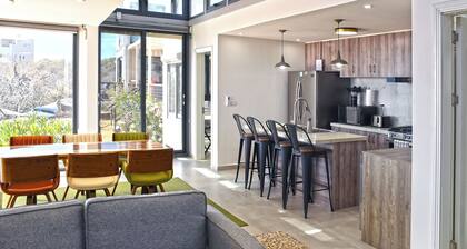 Unique modern repurposed shipping container home. 250mb+ WiFi with Starlink backup. Lounge in a hammock or day bed on one deck or teak furniture w/ firepit on the other. Store gear in a large secure guest locker. Free use of SUPs and beach toys.