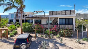 Exterior - Unique modern repurposed shipping container home. 250mb+  WiFi with Starlink backup.  Lounge in a hammock or day bed on one deck or teak furniture w/ firepit on the other.  Store gear in a large secure guest locker.  Free use of SUPs and beach toys. (El Sargento)