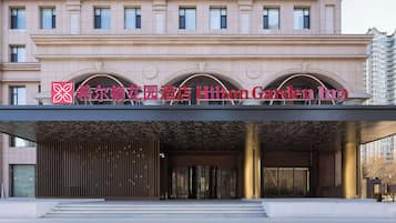 Classic architecture meets elegant design at this inviting hotel entrance.