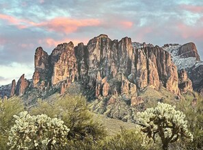 A rugged mountain range with prominent rock formations and sparse vegetation. - Desert Oasis: 4BD/3BA- Pool/ 2 Living Rooms / Sleeps 8 (Mesa)