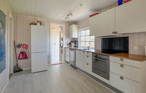 Fridge, stovetop, dishwasher, coffee/tea maker