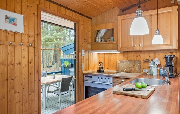 Fridge, stovetop, dishwasher, coffee/tea maker