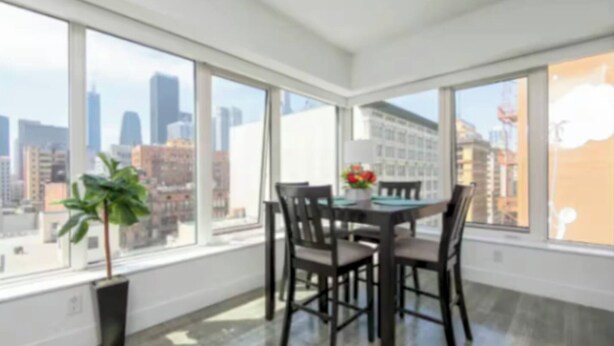 A modern room with large windows, a dining table, and chairs. - City Skyline Views 3Bed Apt with Rooftop Pool, Spa,& Rooftop deck (Los Angeles)