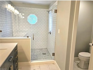 Shower, towels, soap, toilet paper