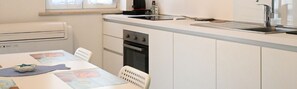 Fridge, oven, dishwasher, dining tables