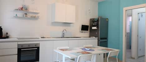Fridge, oven, dishwasher, dining tables