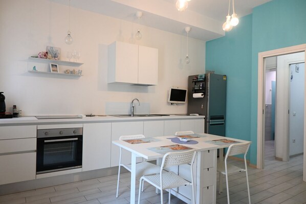 Fridge, oven, dishwasher, dining tables