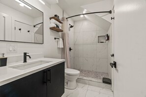 Shower, hair dryer, towels, soap