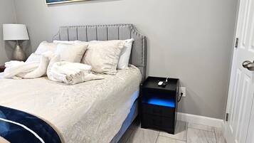 1 bedroom, desk, iron/ironing board, travel crib