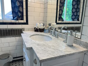 Shower, towels, soap, toilet paper