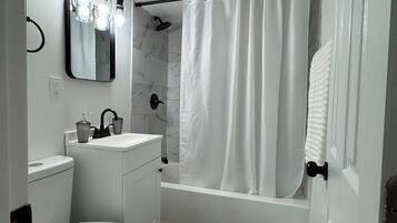 Hair dryer, towels, soap, toilet paper