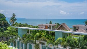 A resort with multiple buildings, a view of the ocean, and lush greenery. - 5 Star Villa with 5 Bedrooms, Bali Villa 2178 (Bali)