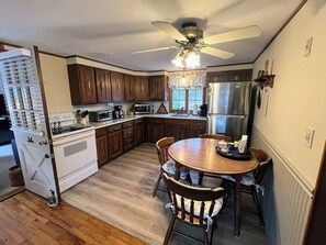 Microwave, coffee/tea maker, toaster, dining tables
