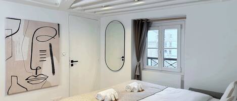 1 bedroom, desk, iron/ironing board, travel crib