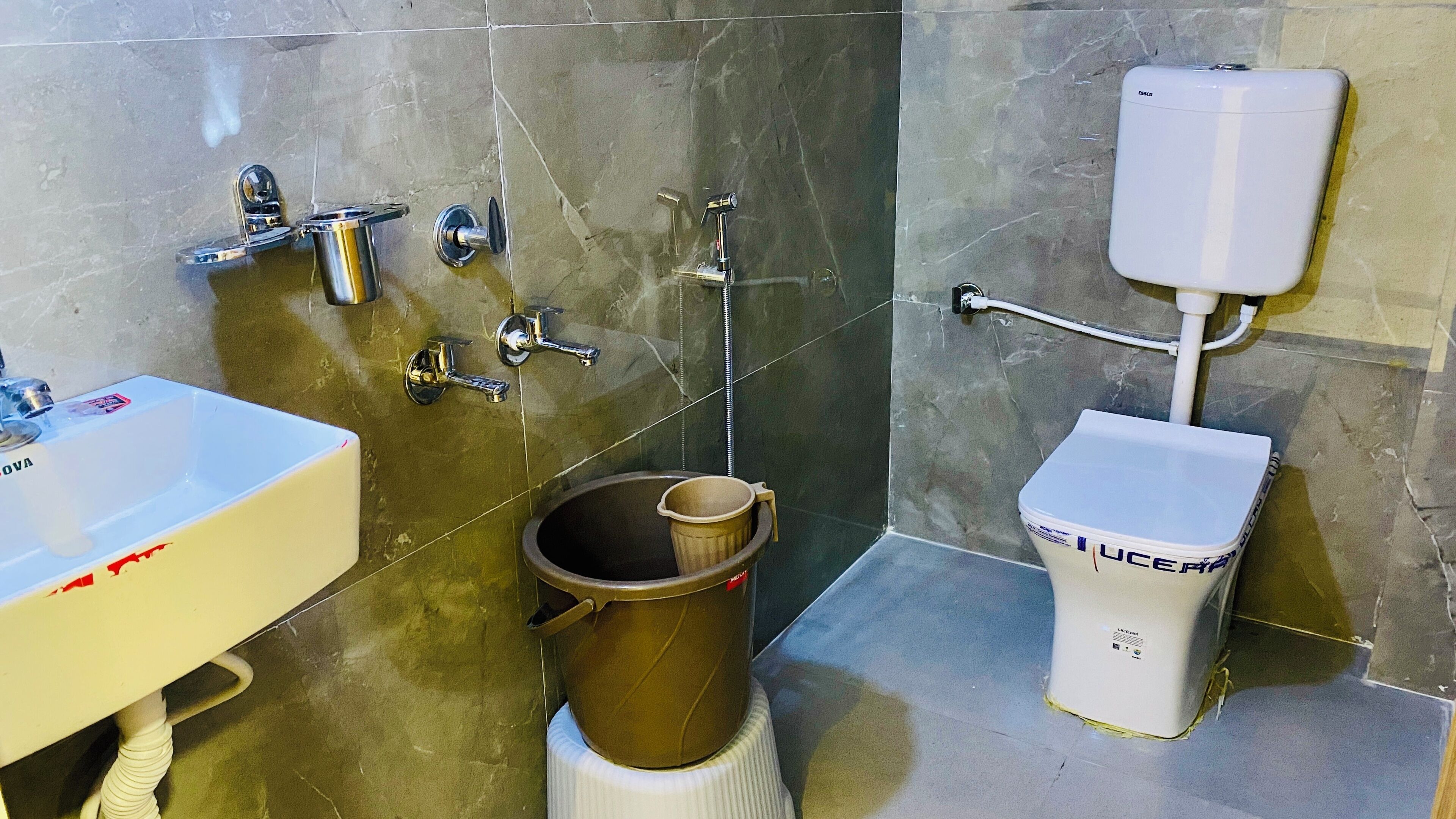 A bathroom with a sink, toilet, and shower.