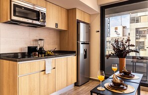 Fridge, microwave, stovetop, coffee/tea maker