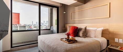 1 bedroom, desk, iron/ironing board, travel crib