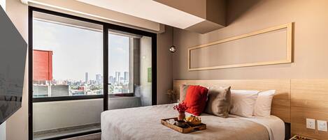 1 bedroom, desk, iron/ironing board, travel crib