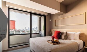 1 bedroom, desk, iron/ironing board, travel crib