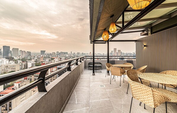 Relax and dine on the rooftop terrace with a panoramic view of the city skyline.