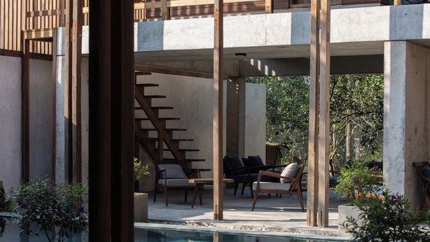 A pool area with lounge chairs and a staircase. - Hachi Homestay & Spa (Hue)