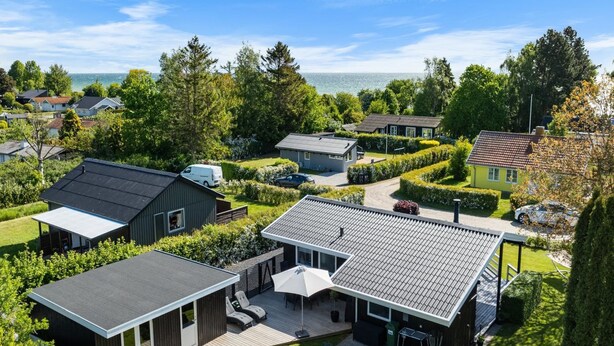 A residential area with modern houses, a large deck, and a view of the sea. - "Bjart" - 150m from the sea by Interhome (Hesselager)