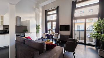 Comfort Apartment, Balcony, Courtyard View | Living area | 50-inch LED TV with cable channels