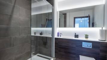 Shower, hair dryer, towels, soap