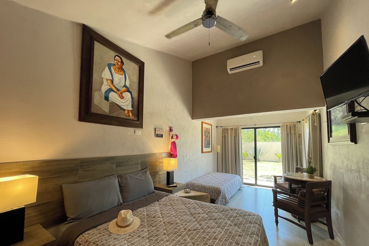 Deluxe Triple Room, 1 Bedroom, Non Smoking, Garden View | 1 bedroom, in-room safe, individually decorated, laptop workspace