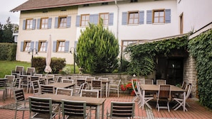 A building with multiple windows and a tiled roof. - Berger's Bergsicht by edita (Scheidegg)