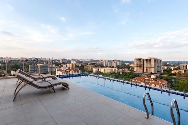 Swim above the city 🌇 Enjoy our relaxing rooftop pool.