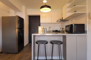 Fridge, microwave, stovetop, coffee/tea maker