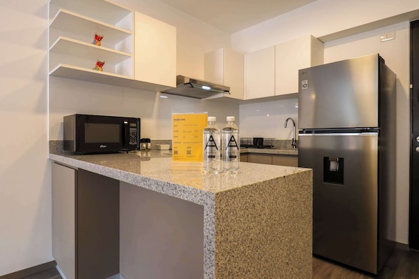 Fridge, microwave, stovetop, coffee/tea maker