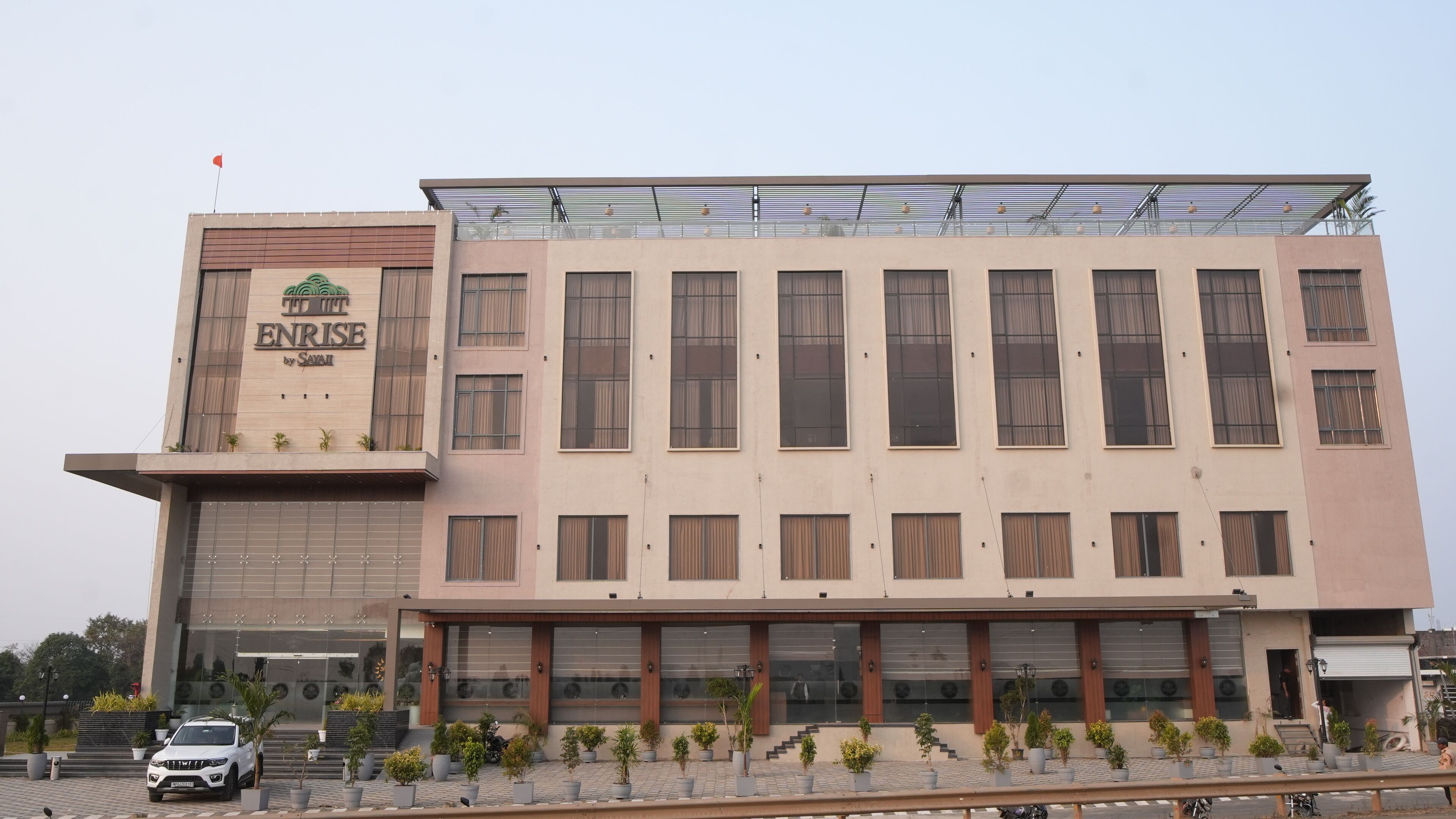 A multi-story hotel with a prominent sign reading "TRIANGLE ENTRANCE".